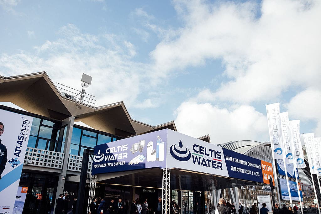 Image of a banner structure outside entrance C, branded with Celtis water advertising.