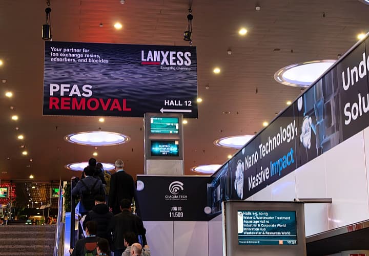 Image of a hanging banner branded with Lanxess advertising.