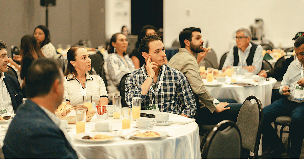 Visitors sitting around tables